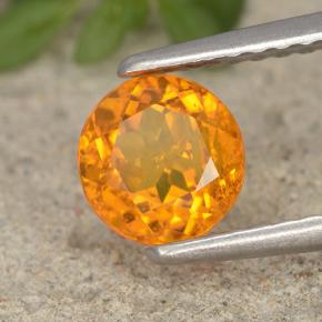 Clinohumita laranja natural 0,94ct, corte redondo, VS-SI