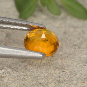 Clinohumita laranja natural 0,41ct, corte oval, VS-SI