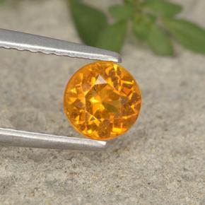 Clinohumita Amarelo alaranjado Natural 0.63ct, Corte Redondo, VS-SI