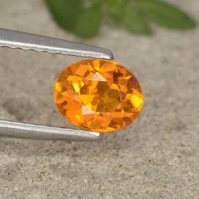 Clinohumita laranja natural 0,62ct, corte oval, VS-SI