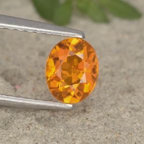 Clinohumita laranja natural 0,62ct, corte oval, VS-SI