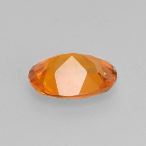 Clinohumita laranja natural 0,52ct, corte oval, VS-SI
