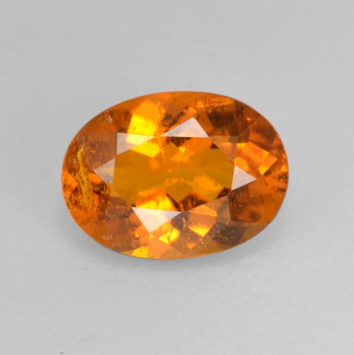 Clinohumita laranja natural 0,82ct, corte oval, SI