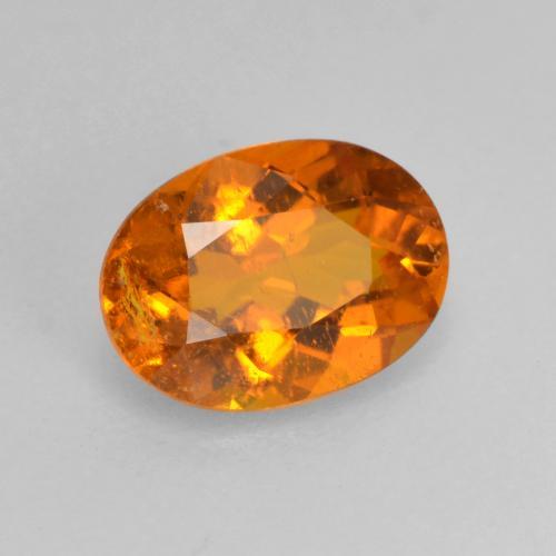 Clinohumita laranja natural 0,82ct, corte oval, SI