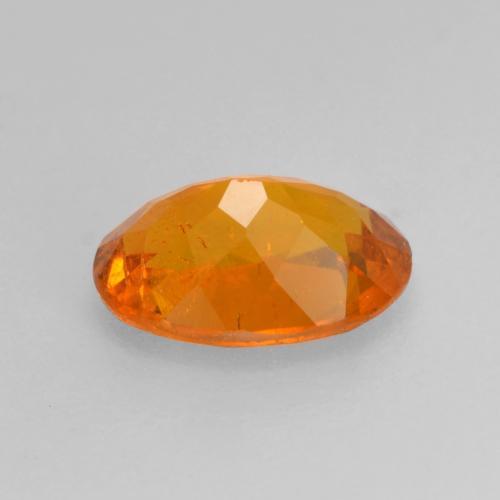 Clinohumita laranja natural 0,82ct, corte oval, SI