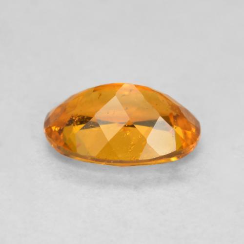 Clinohumita laranja natural 0,85ct, corte oval, SI-I1