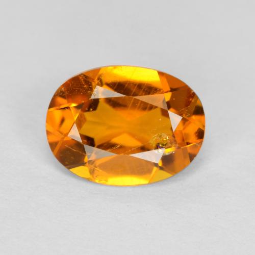 Clinohumita laranja natural 0,89ct, corte oval, SI