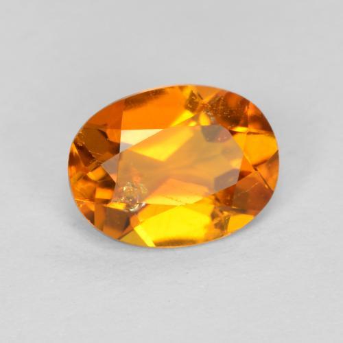 Clinohumita laranja natural 0,89ct, corte oval, SI
