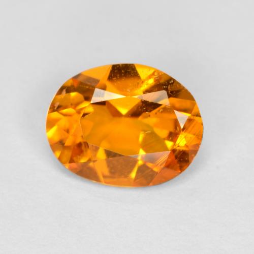 Clinohumita laranja natural 0,68ct, corte oval, SI