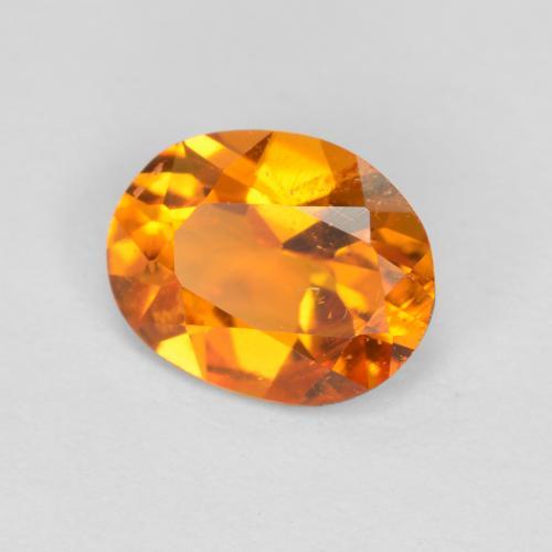 Clinohumita laranja natural 0,68ct, corte oval, SI