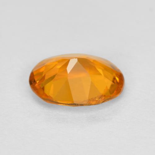 Clinohumita laranja natural 0,68ct, corte oval, SI