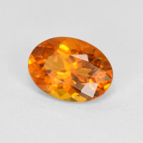 Clinohumita laranja natural 0,74ct, corte oval, SI
