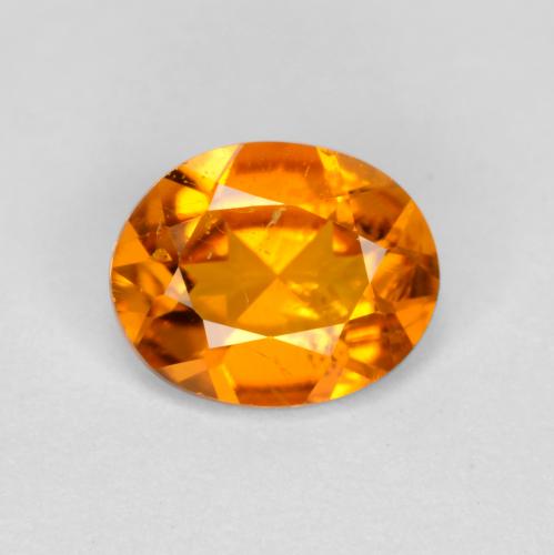 Clinohumita laranja natural 0,54ct, corte oval, SI