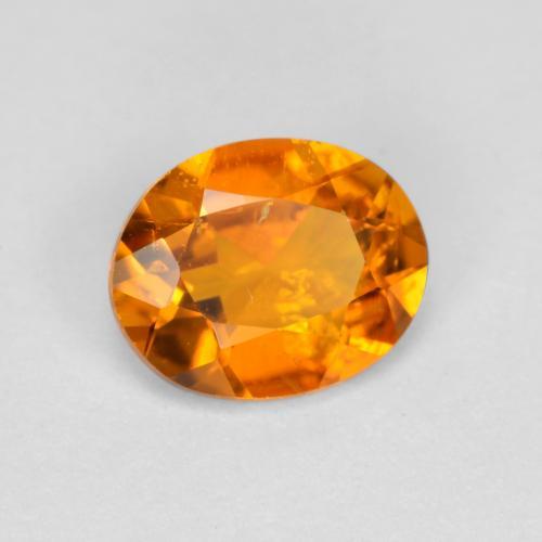 Clinohumita laranja natural 0,54ct, corte oval, SI