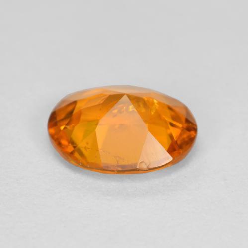 Clinohumita laranja natural 0,54ct, corte oval, SI