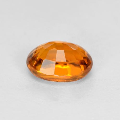 Clinohumita laranja natural 0,38ct, corte oval, VS