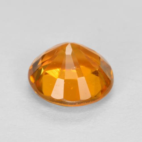 Clinohumita laranja natural 0,48ct, corte redondo, VS