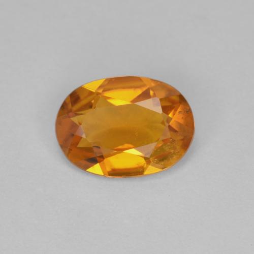 Clinohumita laranja natural 0,90ct, corte oval, VS-SI