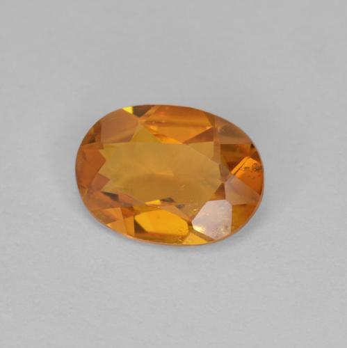 Clinohumita laranja natural 0,90ct, corte oval, VS-SI