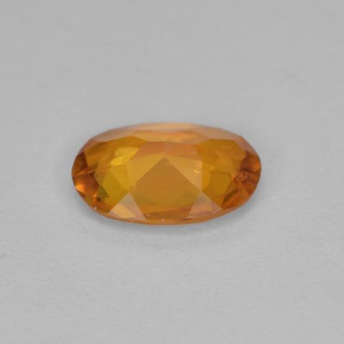 Clinohumita laranja natural 0,90ct, corte oval, VS-SI