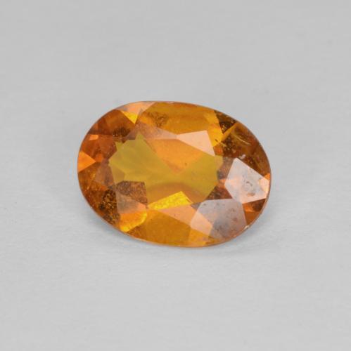 Clinohumita laranja natural 0,94ct, corte oval, SI