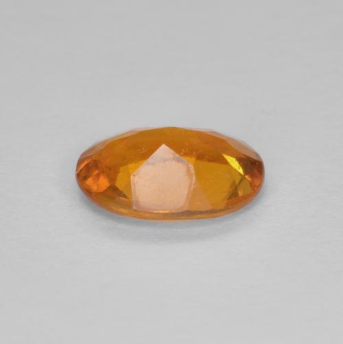 Clinohumita laranja natural 0,94ct, corte oval, SI