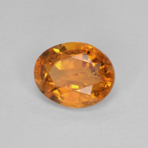 Clinohumita laranja natural 0,91ct, corte oval, SI