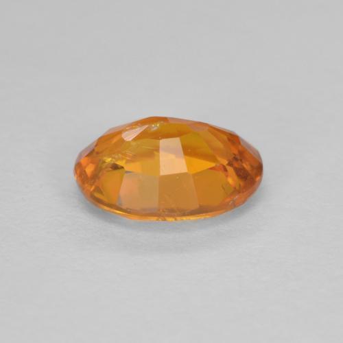 Clinohumita laranja natural 0,91ct, corte oval, SI