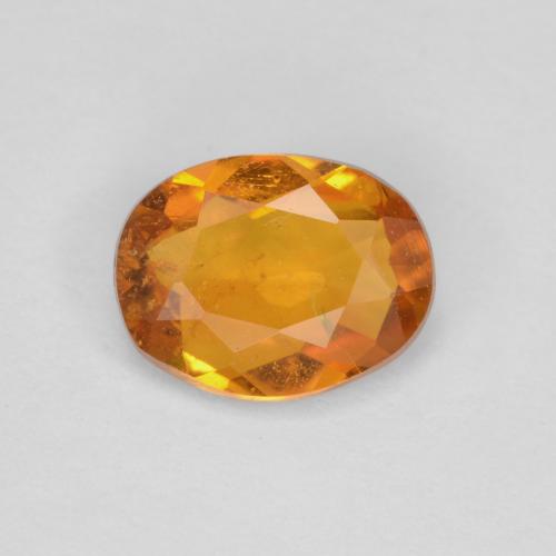 Clinohumita laranja marrom Natural 0.65ct, Corte Oval, SI