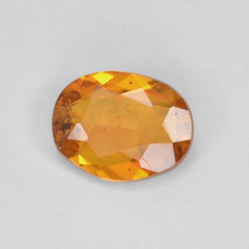 Clinohumita laranja marrom Natural 0.65ct, Corte Oval, SI