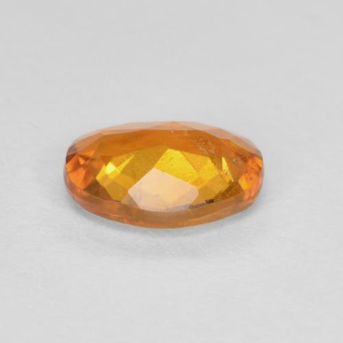 Clinohumita laranja marrom Natural 0.65ct, Corte Oval, SI