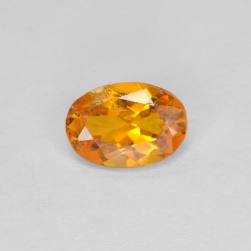 Clinohumita damasco laranja Natural 0.60ct, Corte Oval, SI