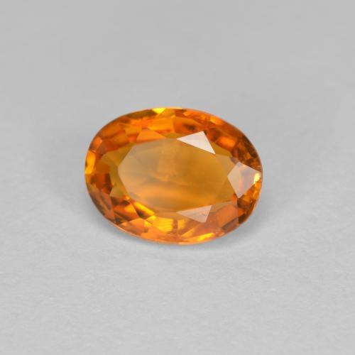 Clinohumita laranja natural 0,81ct, corte oval, VS-SI
