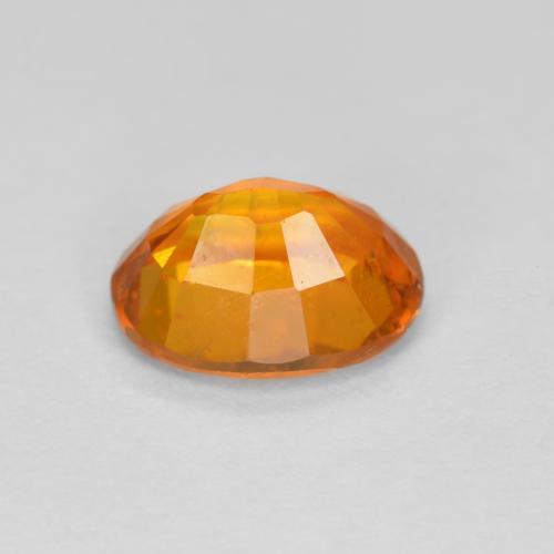 Clinohumita laranja natural 1,38ct, corte oval, VS-SI