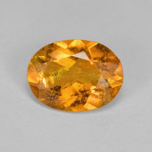 Clinohumita laranja natural 1,43ct, corte oval, SI