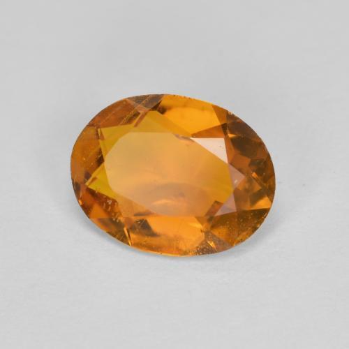 Clinohumita laranja natural 1,34ct, corte oval, SI