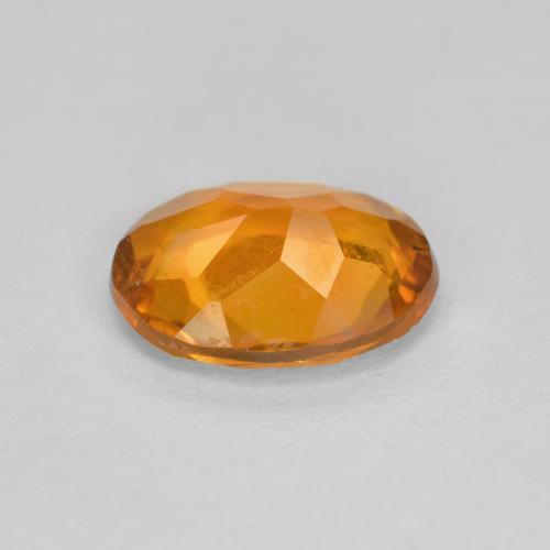 Clinohumita laranja natural 1,34ct, corte oval, SI