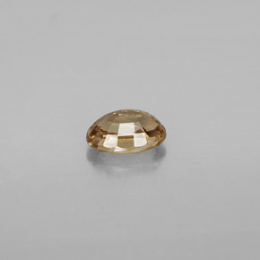 Granada de mudança de cor dourado natural 0,69ct, corte oval, VVS-VS