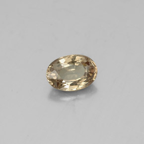 Granada de mudança de cor amarelo natural 0,62ct, corte oval, VS