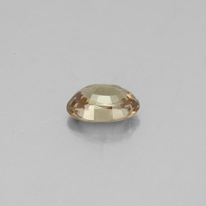 Granada de mudança de cor amarelo natural 0,62ct, corte oval, VS