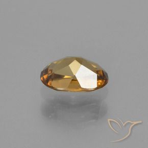 Granada de mudança de cor dourado natural 0,72ct, corte oval, VVS-VS