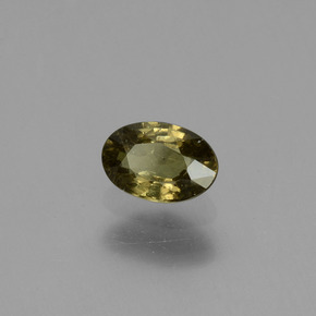 Granada de mudança de cor amarelo natural 0,63ct, corte oval, VS