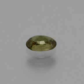 Granada de mudança de cor amarelo natural 0,63ct, corte oval, VS