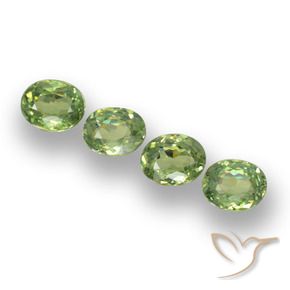 Pedras preciosas de Granada demantóide verde quente natural de 1.23 ct, oval, VS