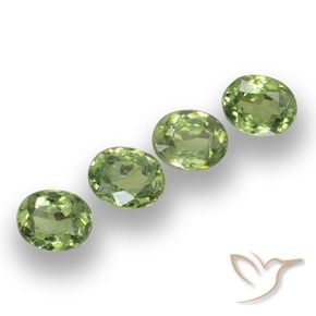 Pedras preciosas de Granada demantóide verde quente natural de 1.36 ct, oval, VS