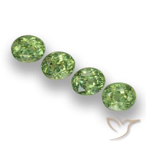 Pedras preciosas de Granada demantóide verde quente natural de 1.57 ct, oval, VS