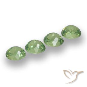 Pedras preciosas de Granada demantóide verde quente natural de 1.57 ct, oval, VS