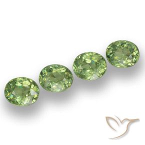 Pedras preciosas de Granada demantóide verde quente natural de 1.78 ct, oval, VS