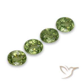Pedras preciosas de Granada demantóide verde quente natural de 1.48 ct, oval, VS