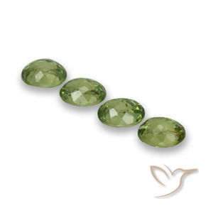 Pedras preciosas de Granada demantóide verde quente natural de 1.48 ct, oval, VS